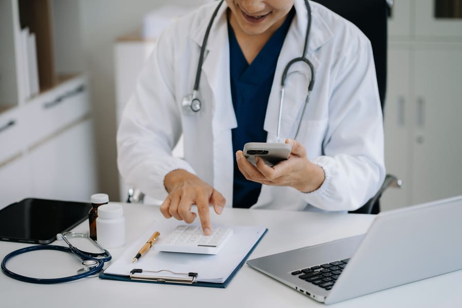 Physician signing medical billing contract